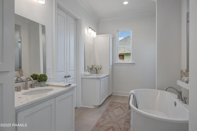 203 Redfern St, Lafayette, LA 70508 - full bath featuring two vanities, a freestanding bath, crown molding, and recessed lighting