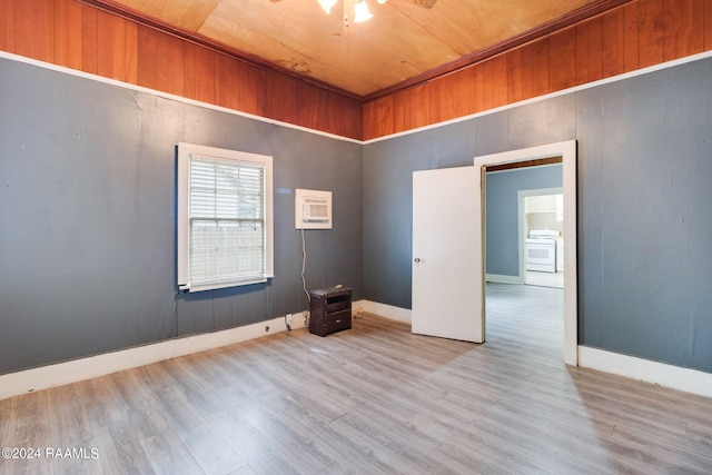 312 Hobson St, Lafayette, LA 70501 - spare room featuring wood finished floors, a wall mounted AC, ceiling fan, baseboards, and wooden ceiling