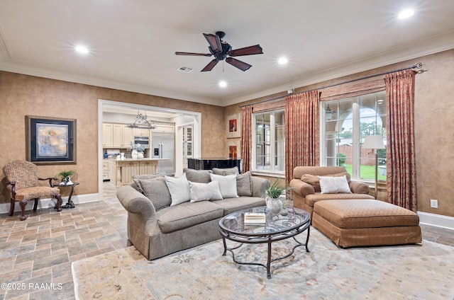 104 Avallach Dr, Lafayette, LA 70503 - living area featuring stone tile floors, baseboards, ceiling fan, recessed lighting, and crown molding