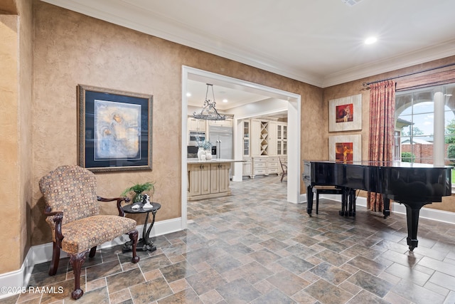 104 Avallach Dr, Lafayette, LA 70503 - sitting room with baseboards, ornamental molding, stone tile floors, a chandelier, and recessed lighting