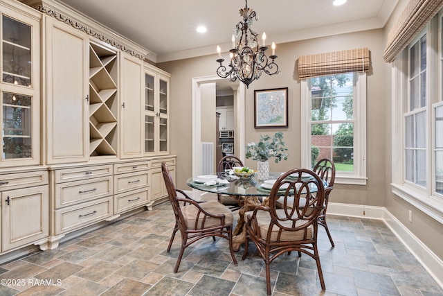 104 Avallach Dr, Lafayette, LA 70503 - dining area with stone tile flooring, plenty of natural light, baseboards, a chandelier, and crown molding