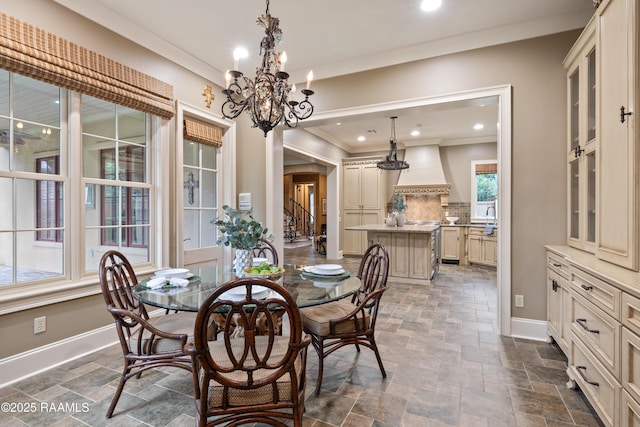 104 Avallach Dr, Lafayette, LA 70503 - dining room featuring stone tile flooring, a chandelier, baseboards, ornamental molding, and recessed lighting