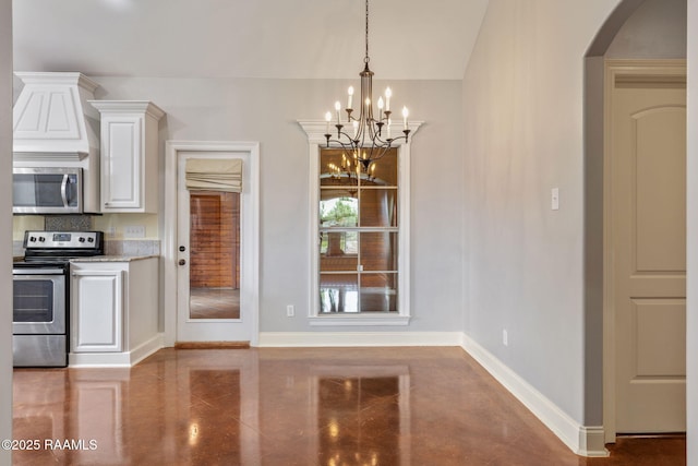 103 Swallows Pass, Carencro, LA 70520 - unfurnished dining area with a chandelier, baseboards, arched walkways, and tile patterned floors
