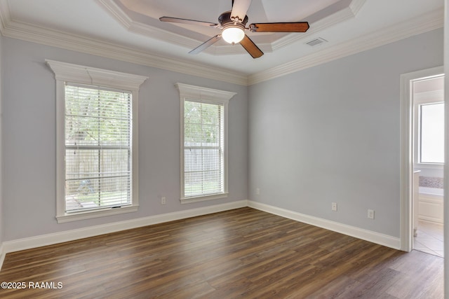 103 Swallows Pass, Carencro, LA 70520 - spare room with dark wood-style flooring, a ceiling fan, crown molding, baseboards, and a tray ceiling