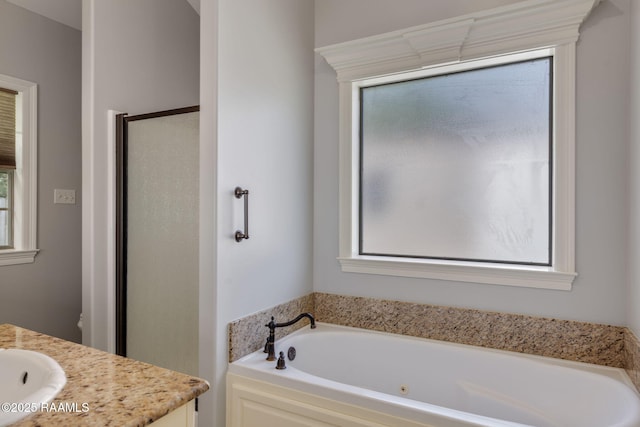 103 Swallows Pass, Carencro, LA 70520 - full bath featuring vanity, healthy amount of natural light, and a whirlpool tub