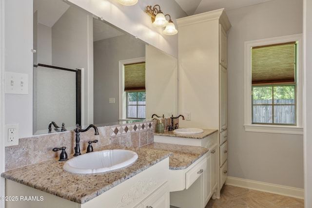 103 Swallows Pass, Carencro, LA 70520 - bathroom featuring vanity, plenty of natural light, baseboards, and a stall shower