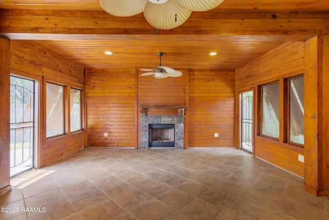 103 Swallows Pass, Carencro, LA 70520 - unfurnished living room with ceiling fan, wood walls, a high end fireplace, recessed lighting, and wood ceiling