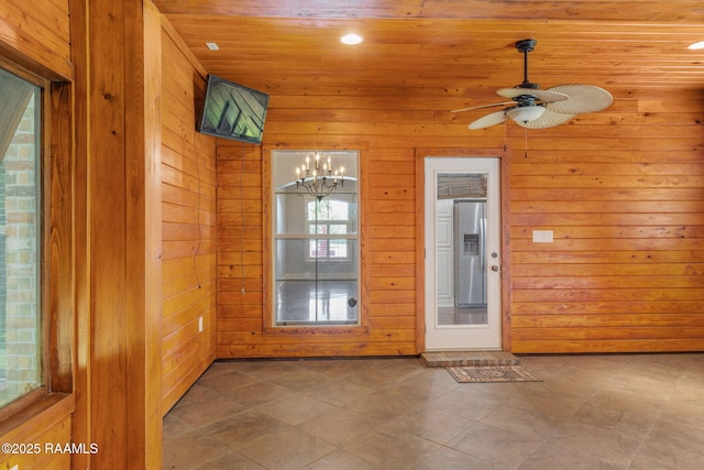 103 Swallows Pass, Carencro, LA 70520 - unfurnished room featuring wood walls, wood ceiling, a ceiling fan, and a chandelier
