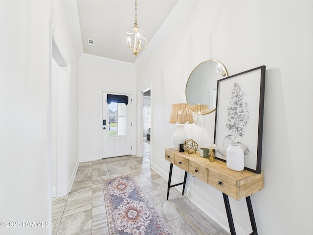 143 Melanie Rose Dr, Maurice, LA 70555 - foyer featuring a chandelier, ornamental molding, and baseboards