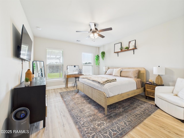 143 Melanie Rose Dr, Maurice, LA 70555 - bedroom with wood finished floors, baseboards, a desk, and ceiling fan