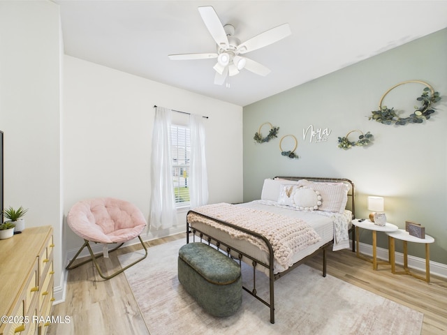 143 Melanie Rose Dr, Maurice, LA 70555 - bedroom with light wood-type flooring, baseboards, and a ceiling fan