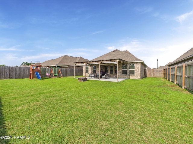 143 Melanie Rose Dr, Maurice, LA 70555 - rear view of property featuring a patio, a playground, and brick siding