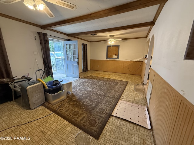 2015 Cummings St, Opelousas, LA 70570 - entrance foyer with a ceiling fan, wainscoting, beam ceiling, and arched walkways