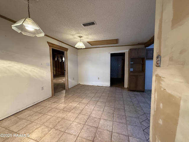 2015 Cummings St, Opelousas, LA 70570 - spare room with a textured ceiling and light tile patterned floors