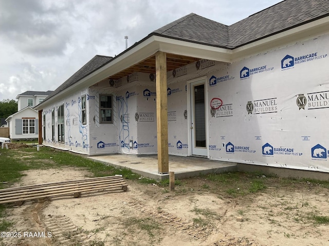 119 Lenova Ln, Lafayette, LA 70507 - doorway to property with a shingled roof