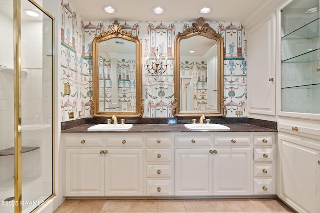 1414 E Bayou Pkwy, Lafayette, LA 70508 - bathroom featuring wallpapered walls, double vanity, a stall shower, and recessed lighting