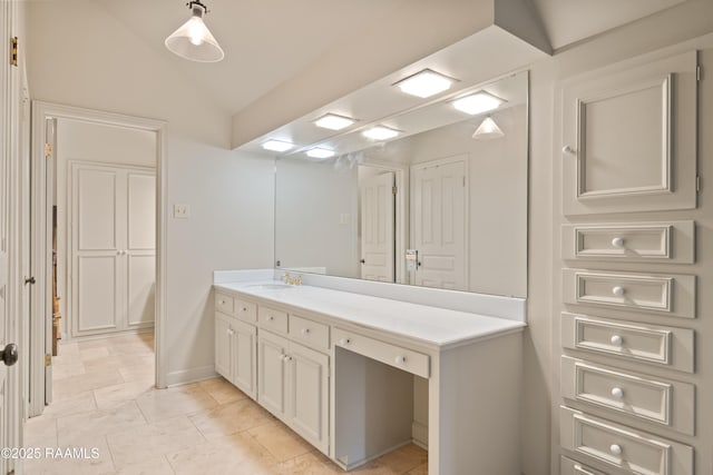 1414 E Bayou Pkwy, Lafayette, LA 70508 - bathroom with vanity, lofted ceiling, and tile patterned flooring