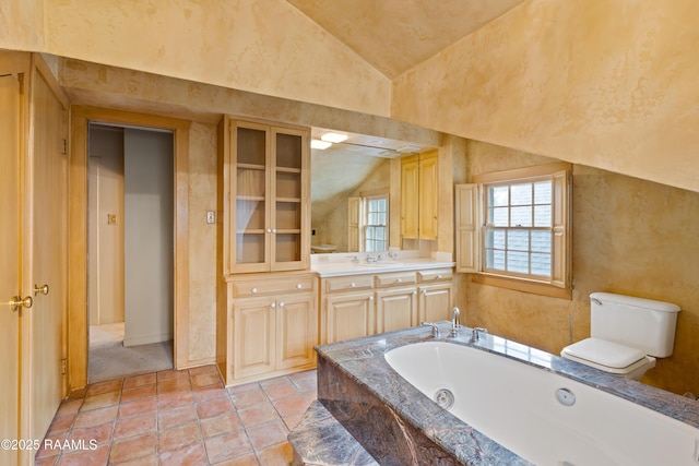 1414 E Bayou Pkwy, Lafayette, LA 70508 - bathroom with a jetted tub, toilet, vanity, and high vaulted ceiling