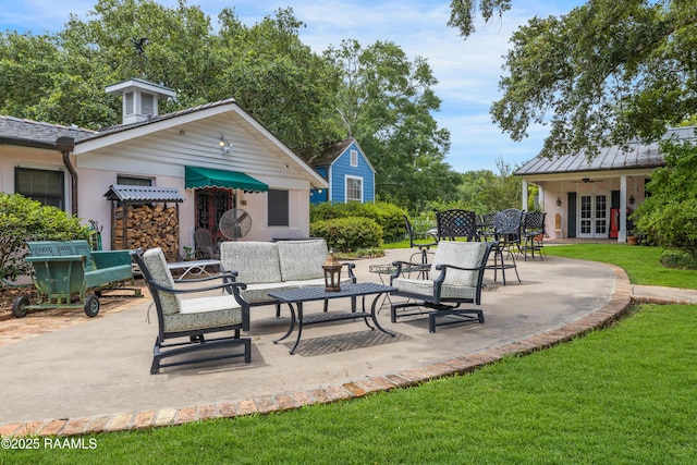 1414 E Bayou Pkwy, Lafayette, LA 70508 - view of patio / terrace featuring french doors, ceiling fan, an outbuilding, and outdoor lounge area