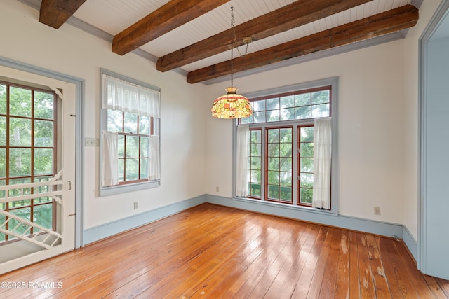 1414 E Bayou Pkwy, Lafayette, LA 70508 - unfurnished room featuring healthy amount of natural light, light wood-style floors, baseboards, and wood ceiling with exposed beams