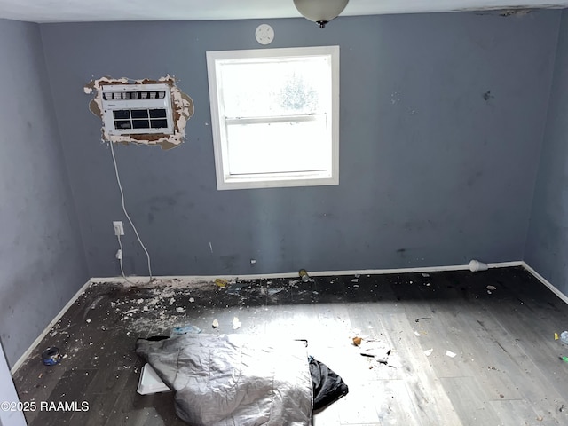223 Lafayette St, Lafayette, LA 70501 - spare room with wood finished floors and baseboards