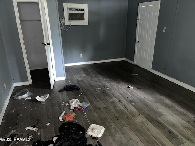 223 Lafayette St, Lafayette, LA 70501 - unfurnished bedroom featuring hardwood / wood-style floors and baseboards