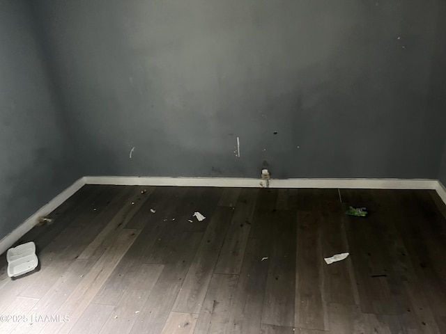 223 Lafayette St, Lafayette, LA 70501 - spare room with hardwood / wood-style flooring and baseboards