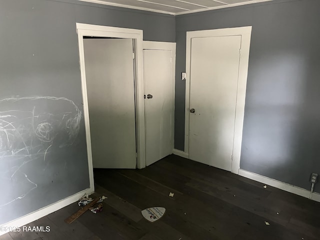 223 Lafayette St, Lafayette, LA 70501 - unfurnished bedroom featuring wood finished floors, a closet, and baseboards