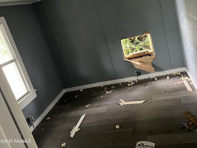223 Lafayette St, Lafayette, LA 70501 - empty room with healthy amount of natural light, baseboards, and wood finished floors