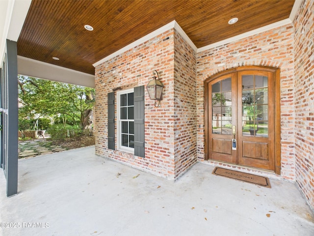 105 Oak Aly, Lafayette, LA 70508 - view of exterior entry with brick siding and french doors