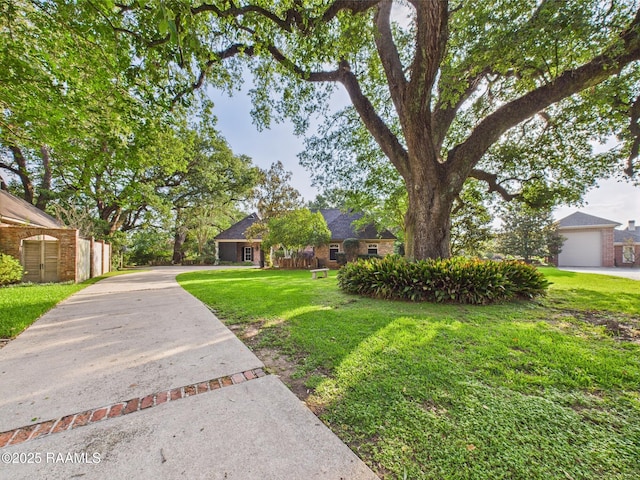 105 Oak Aly, Lafayette, LA 70508 - view of front of home with a front yard and driveway