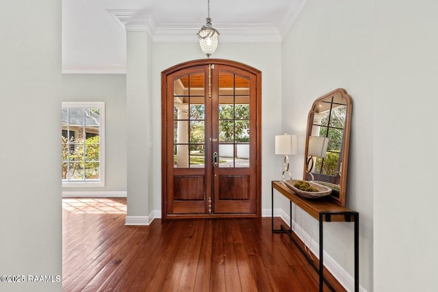 105 Oak Aly, Lafayette, LA 70508 - entryway featuring dark wood-type flooring, ornamental molding, french doors, baseboards, and arched walkways