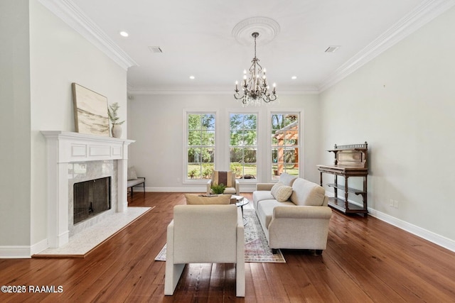 105 Oak Aly, Lafayette, LA 70508 - living area with dark wood finished floors, a premium fireplace, baseboards, a chandelier, and ornamental molding