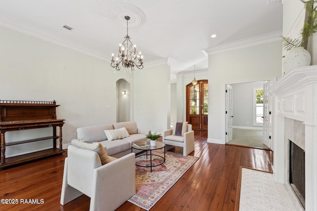 105 Oak Aly, Lafayette, LA 70508 - living area with arched walkways, wood-type flooring, baseboards, crown molding, and recessed lighting