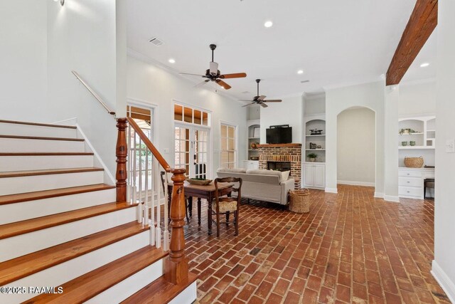 105 Oak Aly, Lafayette, LA 70508 - living room with brick flooring, ceiling fan, ornamental molding, recessed lighting, and baseboards