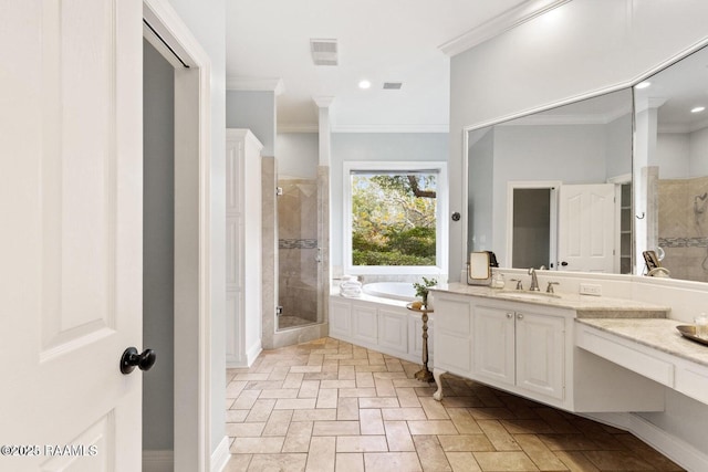 105 Oak Aly, Lafayette, LA 70508 - bathroom featuring vanity, ornamental molding, a shower stall, a bath, and recessed lighting