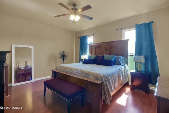 205 Broland Dr, Duson, LA 70529 - bedroom featuring dark wood-style flooring, multiple windows, and baseboards