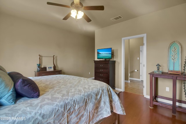 205 Broland Dr, Duson, LA 70529 - bedroom with wood finished floors, a ceiling fan, and baseboards