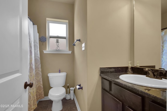 205 Broland Dr, Duson, LA 70529 - bathroom featuring toilet, vanity, tile patterned flooring, and baseboards