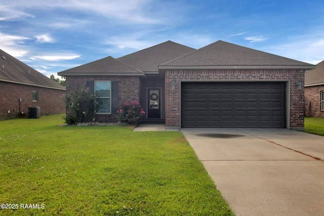 205 Broland Dr, Duson, LA 70529 - view of front facade featuring brick siding, driveway, a front yard, a garage, and roof with shingles