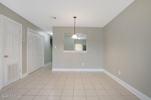 210 Long Plantation Blvd Unit U, Lafayette, LA 70508 - empty room featuring baseboards and light tile patterned floors