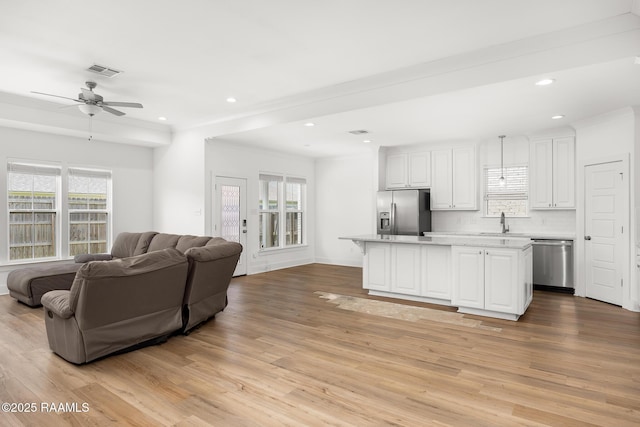 9036 Stonecroft Ave, Baton Rouge, LA 70810 - living area with light wood-style flooring, plenty of natural light, ceiling fan, recessed lighting, and crown molding
