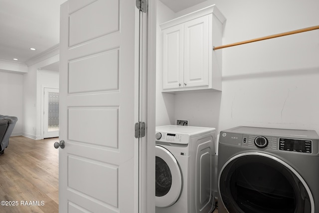 9036 Stonecroft Ave, Baton Rouge, LA 70810 - washroom featuring independent washer and dryer, cabinet space, light wood-style flooring, recessed lighting, and baseboards