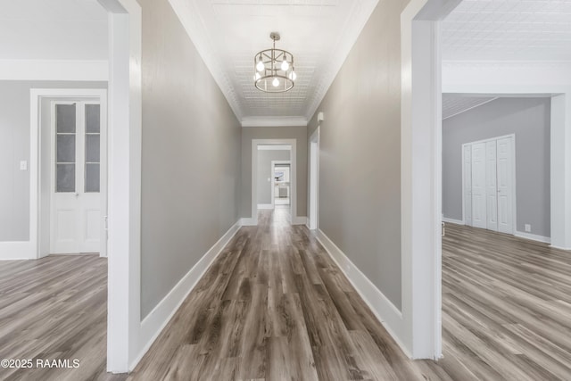 1323 Tarleton, Jeanerette, LA 70544 - corridor with a chandelier, wood finished floors, ornamental molding, and baseboards