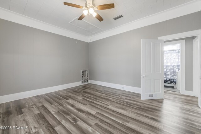 1323 Tarleton, Jeanerette, LA 70544 - empty room with wood finished floors, a ceiling fan, and baseboards