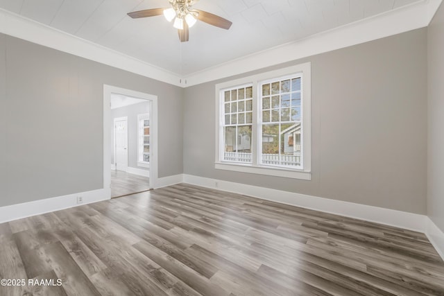1323 Tarleton, Jeanerette, LA 70544 - empty room featuring crown molding, ceiling fan, wood finished floors, and baseboards