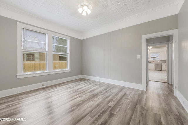 1323 Tarleton, Jeanerette, LA 70544 - unfurnished room with plenty of natural light, light wood-style floors, ceiling fan, and baseboards