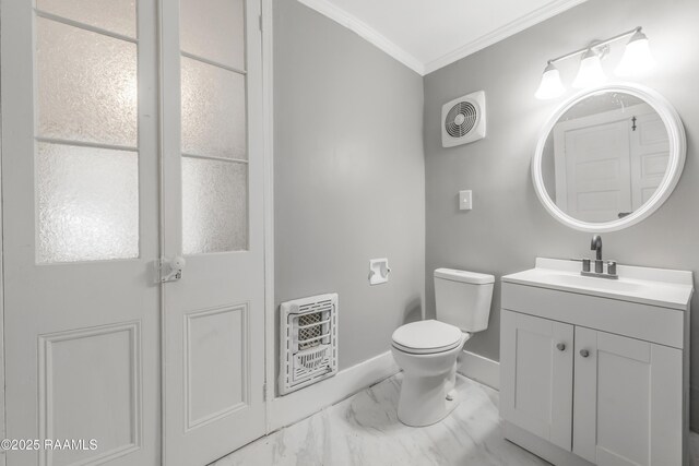 1323 Tarleton, Jeanerette, LA 70544 - bathroom featuring ornamental molding, vanity, marble look tiles, heating unit, and toilet
