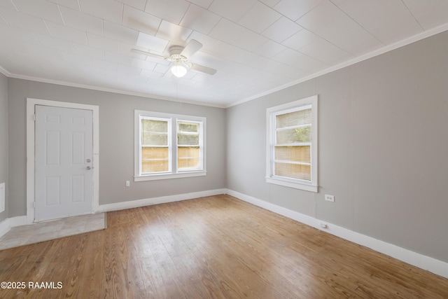 1323 Tarleton, Jeanerette, LA 70544 - spare room with ornamental molding, a ceiling fan, plenty of natural light, wood finished floors, and baseboards