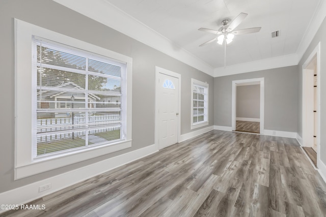 1323 Tarleton, Jeanerette, LA 70544 - unfurnished room with ornamental molding, wood finished floors, a ceiling fan, and baseboards